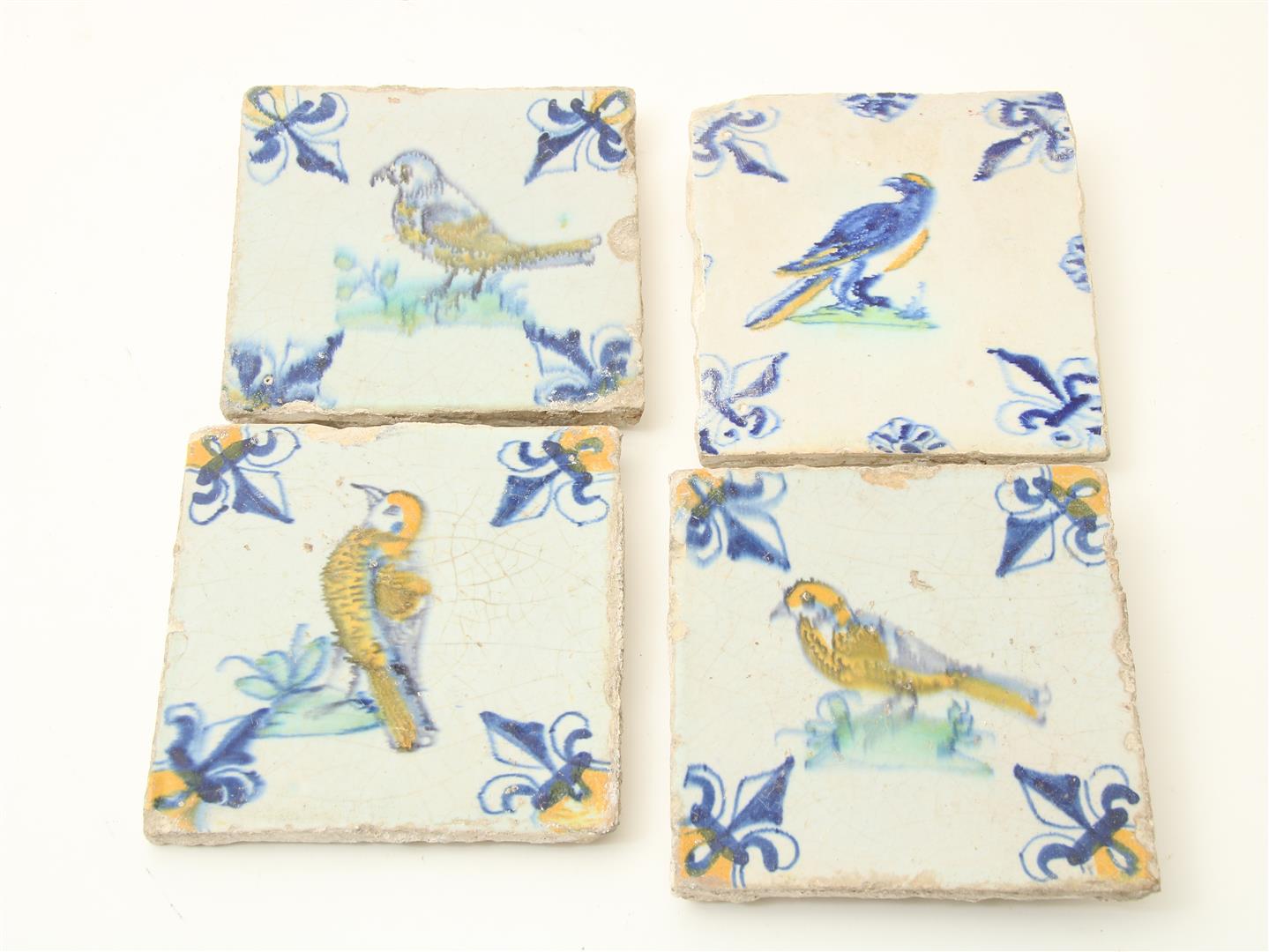 Lot of 4 16th century tiles decorated with polychrome birds, French Lily corner motif, 13 x 13 x 1.2