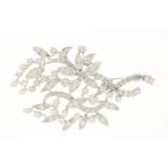 White gold brooch, leaf-shaped, set with brilliant, octagonal and bauquette cut diamonds, approx.