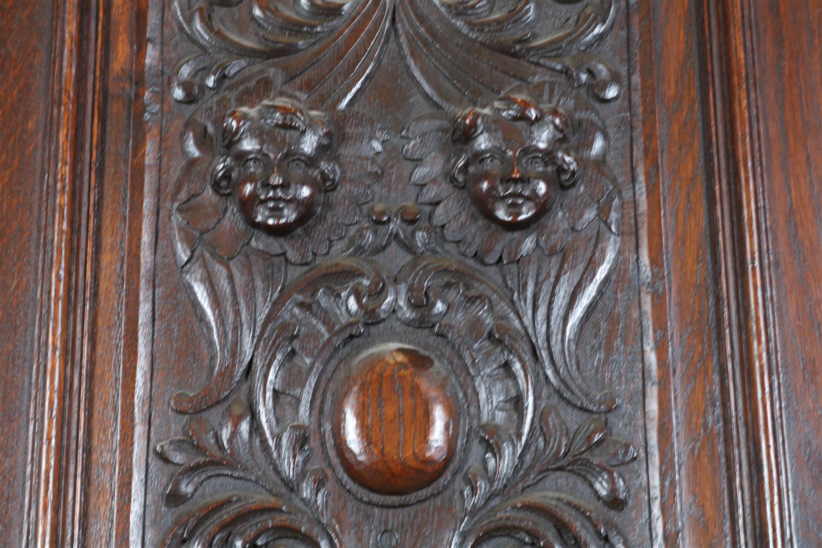 Oak two-door cupboard with 4 carved panels of garlands, putto, shell motifs and crown, flanked by - Image 6 of 9
