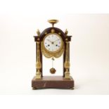 Red marble -Griotte marble- Empire portal mantel clock (Pendule portique) with ormolu ornaments,