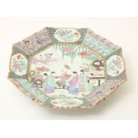 Octagonal porcelain dish, with Famile Rose painting of figures in a garden, napkin work in the