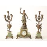 Partly alabaster mantel clock topped with zamak lady, height 57 cm. Includes 2 five-light