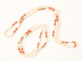 Set with river pearl and red coral