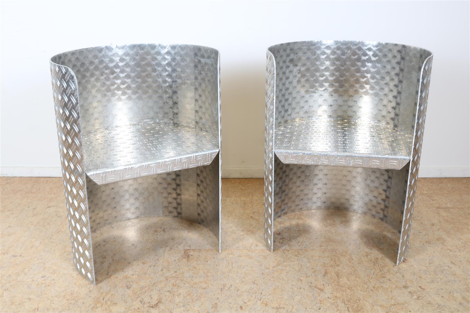 Set of cylindrical aluminum diamond plate design bucket seats with fabric fruit cushions.