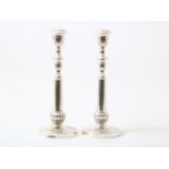 Set of silver one-light candlesticks, grade 900/000, height 26 cm, gross weight 540 grams. (