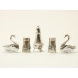 Lot of 5 silver salt cellars and pepper shakers, consisting of: two crystal salt cellars in the