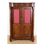 Mahogany Empire bookcase with plinth drawer and 2 panel doors partly covered with mesh and cloth,