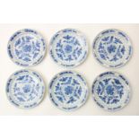 A set of 6 earthenware pancake plates decorated in blue with flowers, leaves and flower vase,
