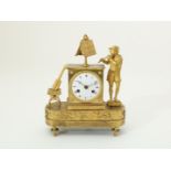 Fire-gilt Empire mantel clock with musician and sheet music, with running and percussion