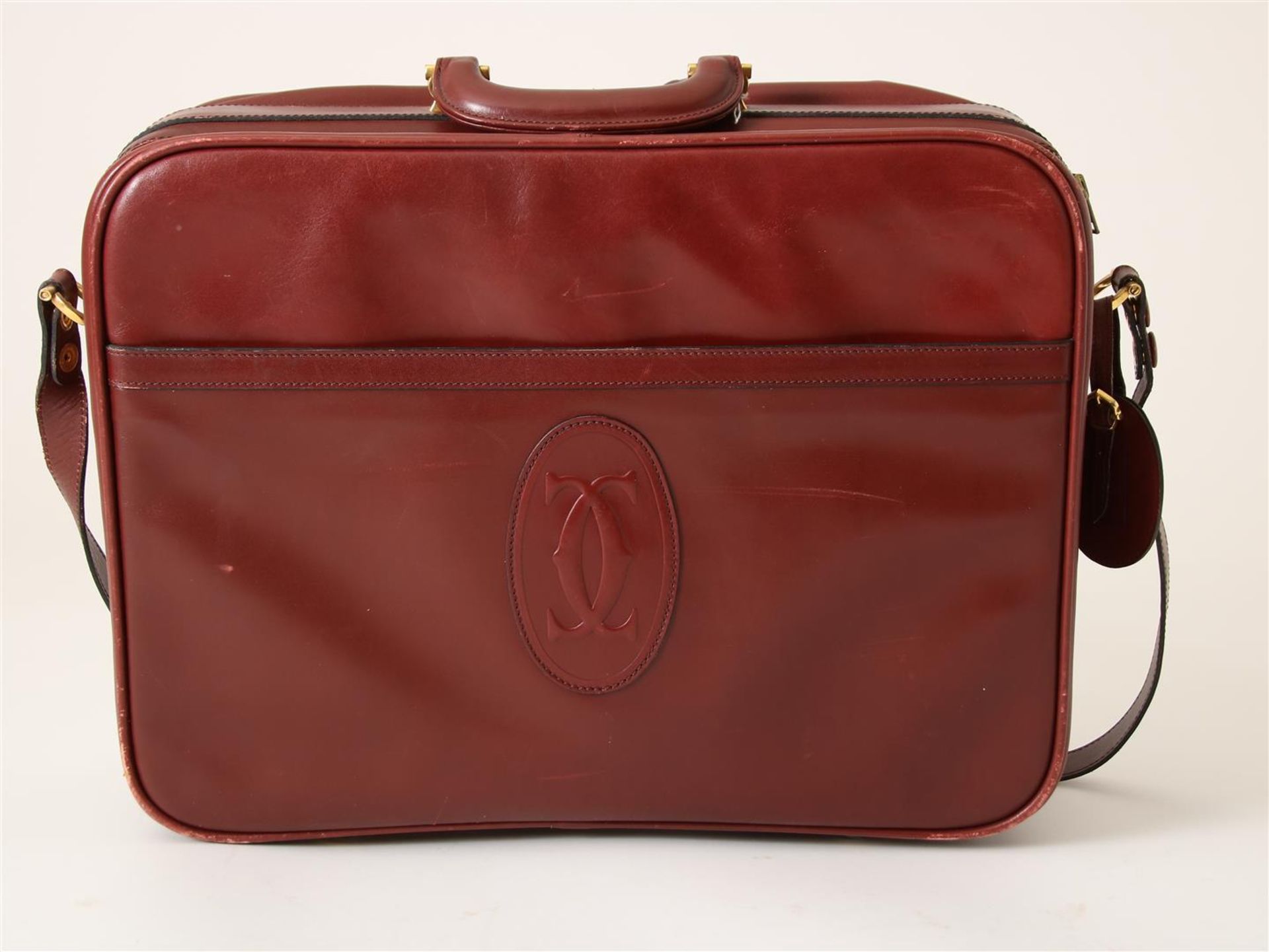 Cartier, red leather vintage briefcase (With signs of wear, in dust bag.)