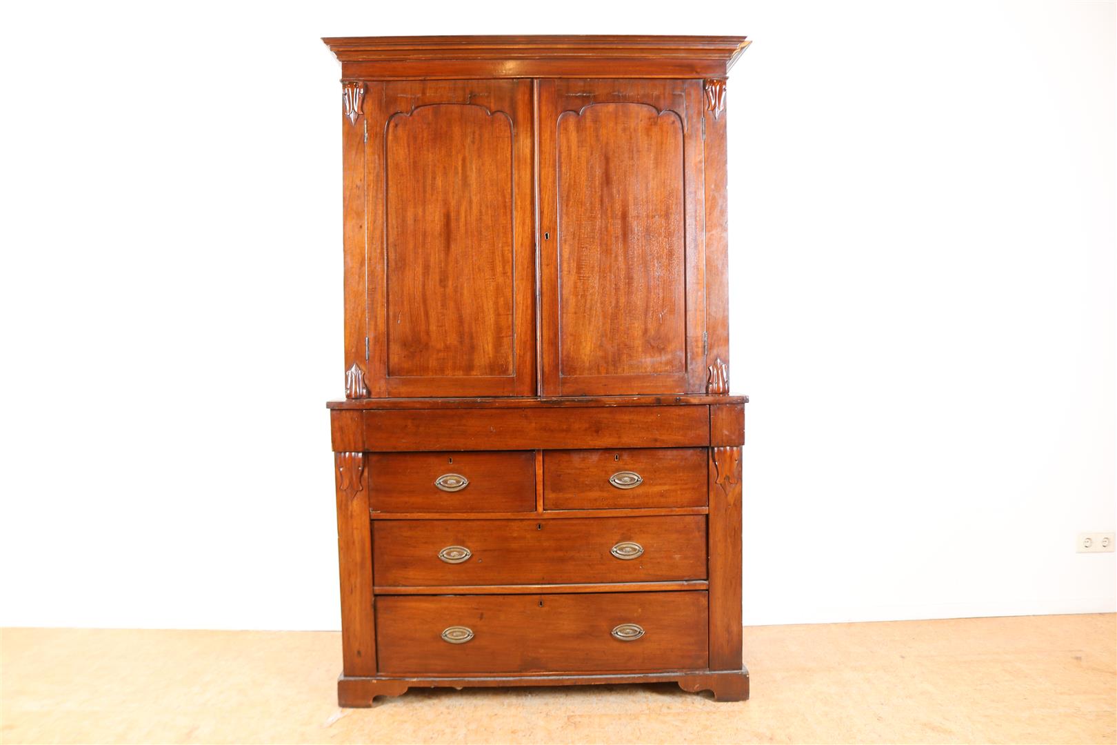 Mahogany cabinet with straight hood, 2 panel doors and 4 drawers, 19th century, 197 x 125 x 52 cm.