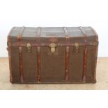 Partly jutte-lined travel suitcase with leather straps and interior clothing compartments, with