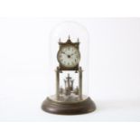 brass clock with glass bell