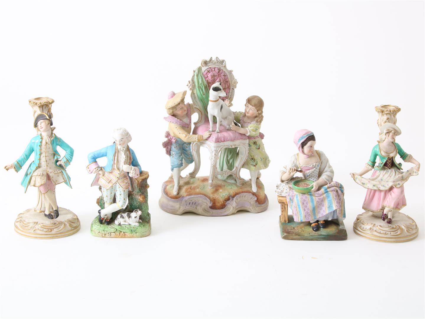 Lot of a polychrome biscuit porcelain sculpture group of 2 children with a dog on a chair, height 28