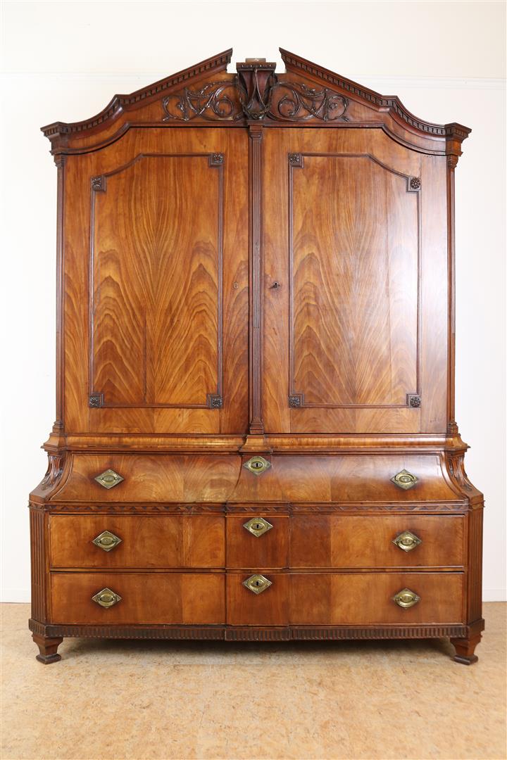 Mahogany Louis XVI breakfront cabinet with carved garlands in crest, 2 panel doors and 3 drawers,