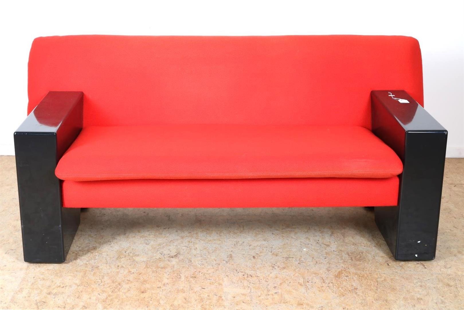 Two-seater sofa with red fabric upholstery and black wooden base, model “Sandwich” (model 750),