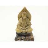 Soapstone sculpture of sitting Buddha on lotus flower, China, 20th century, height 23 cm. (edge
