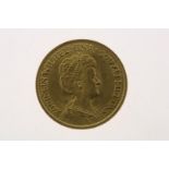 Gold tenner with image of Wilhelmina with updo hair, in an ermine cloak, looking to the right, 1917,