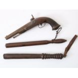 Lot consisting of 2 wooden clubs, including flint pistol with wooden handle, 19th century