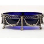 Oval blue glass jardiniere in richly decorated silver frame, resting on claw feet, grade 835/000,