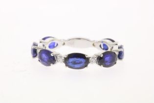 White gold eternity ring with sapphires and diamonds