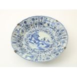 Kraak porcelain dish, large size, with central decor of figures  in a landscape surrounded by