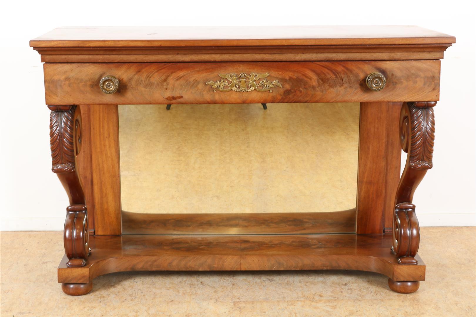 Mahogany Empire trumeau with plinth drawer on volutes with carved acanthus leaves, 2 side leaves and