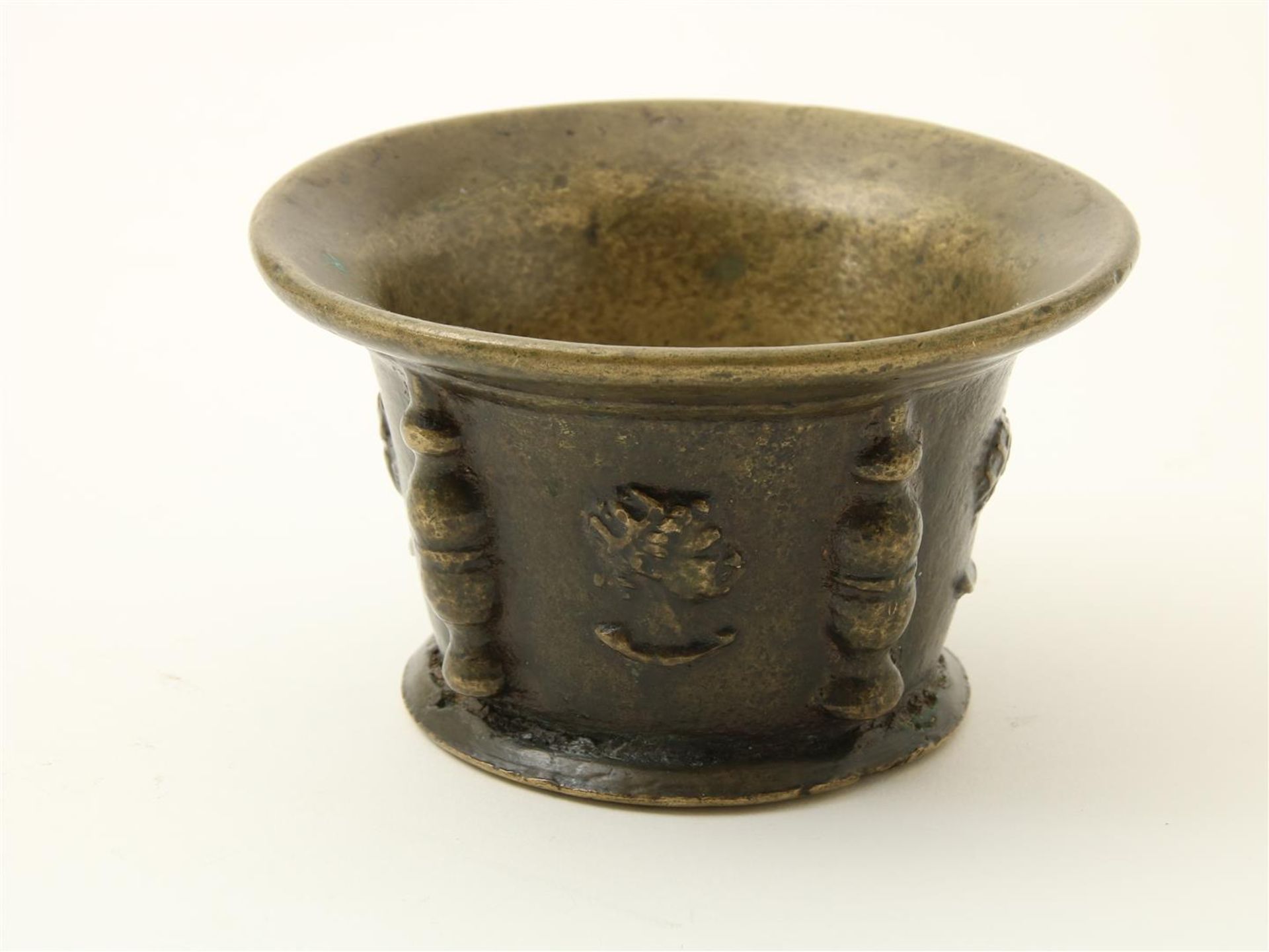 Bronze mortar decorated with ribs and portrait heads, Spain, 17th century.