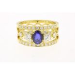 Yellow gold band ring with sapphire and diamond