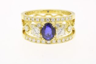 Yellow gold band ring with sapphire and diamond