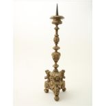 Lime wood candlestick with iron pin, decorated with carved angel heads and acanthus leaves, probably