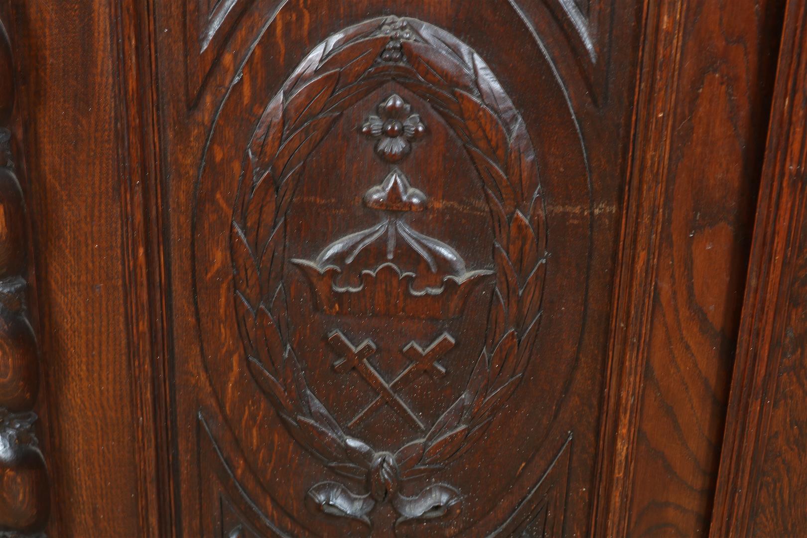 Oak two-door cupboard with 4 carved panels of garlands, putto, shell motifs and crown, flanked by - Image 8 of 9
