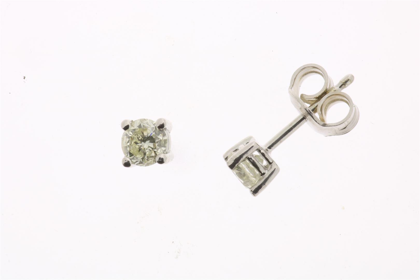 White gold solitaire ear studs set with brilliant cut diamond, 0.46 ct., K/L, P1, gross