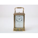 Gilt brass travel clock with enamel dial with Roman numerals, and alarm clock with Arabic