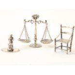 Lot with 3 silver miniatures including piping chair, scales and figure on chair, Dutch hallmark