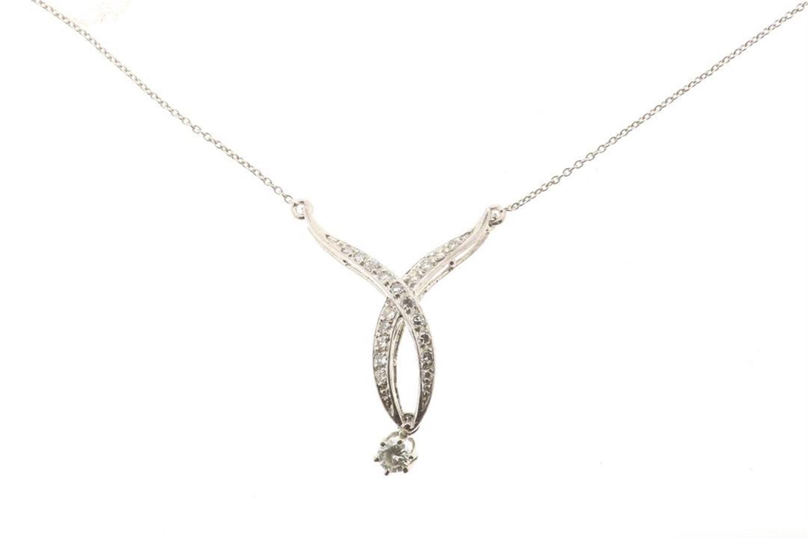 White gold necklace with pendant containing brilliant cut diamonds, approximately 0.10 ct., gross