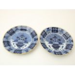 Lot of 2 earthenware faience dishes with floral decoration, so-called Peacock plates, marked "De