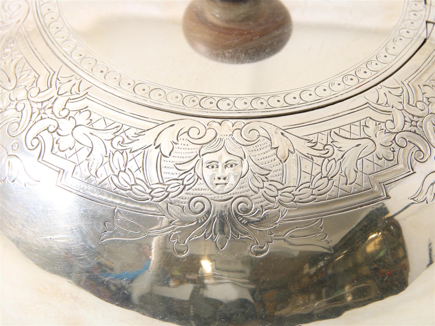 Silver teapot with wooden handle, decorated with floral vines and heads in garlands, England, - Image 3 of 4