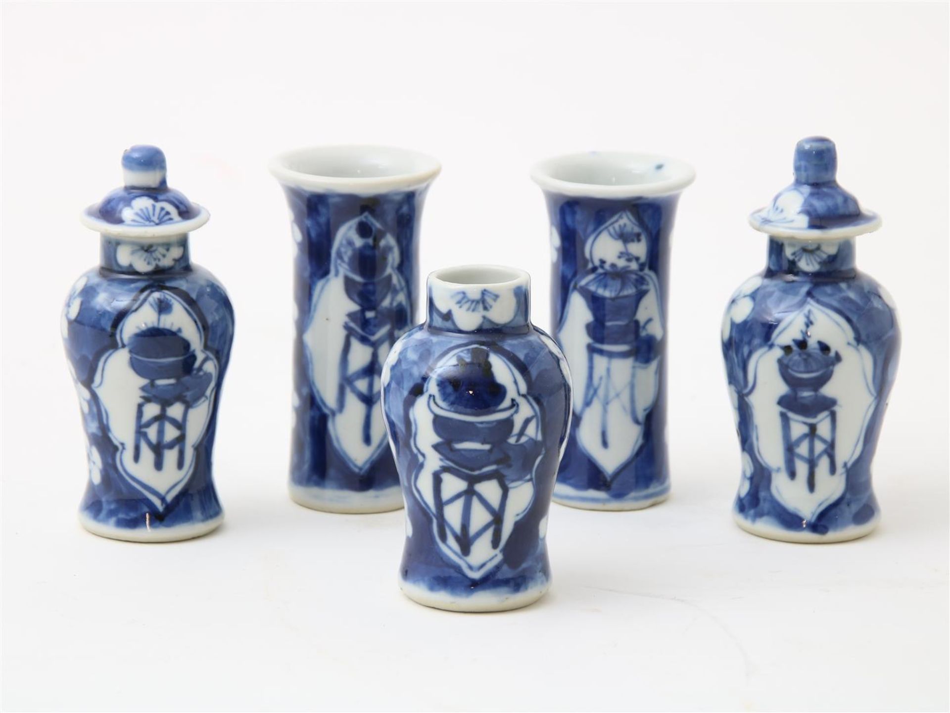 Porcelain miniature cupboard set, lidded vases and 2 tube vases decorated with cracked ice decor and