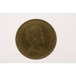 Gold tenner with image of Wilhelmina with updo hair, in an ermine cloak, looking to the right, 1912,