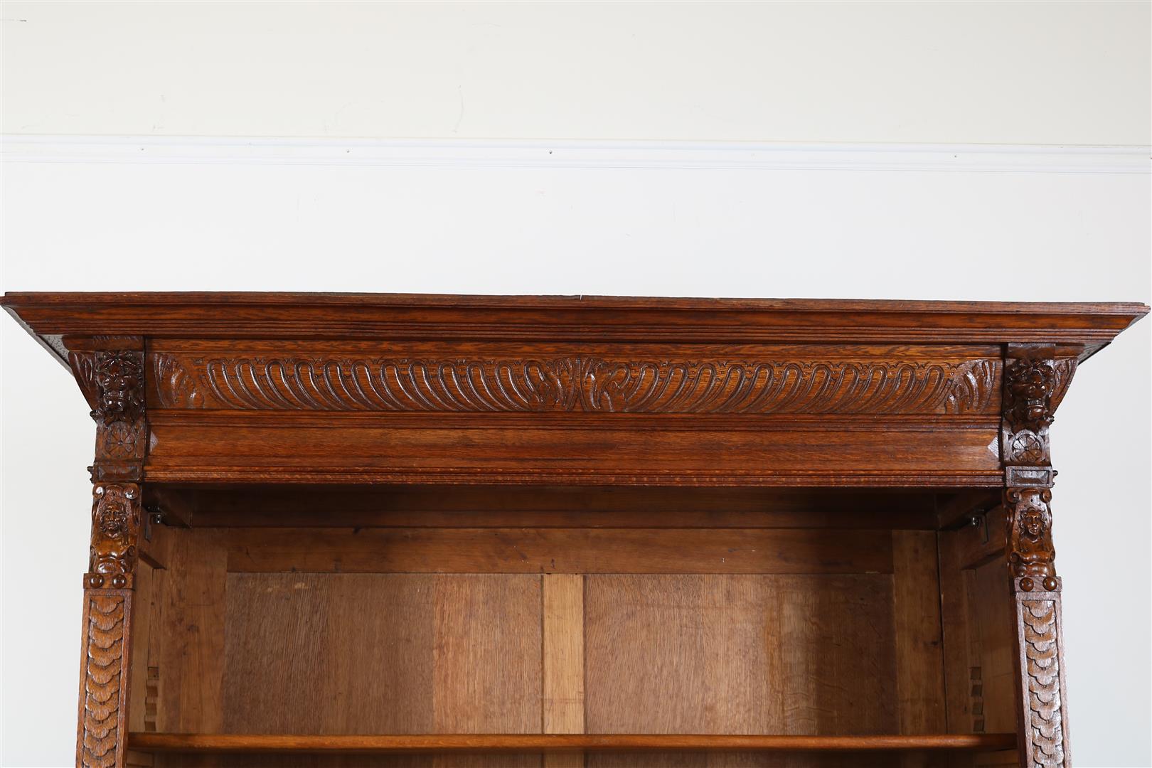 Oak Renaissance style open bookcase with carved "grunts" in the hood and carved lion masks and - Image 3 of 5