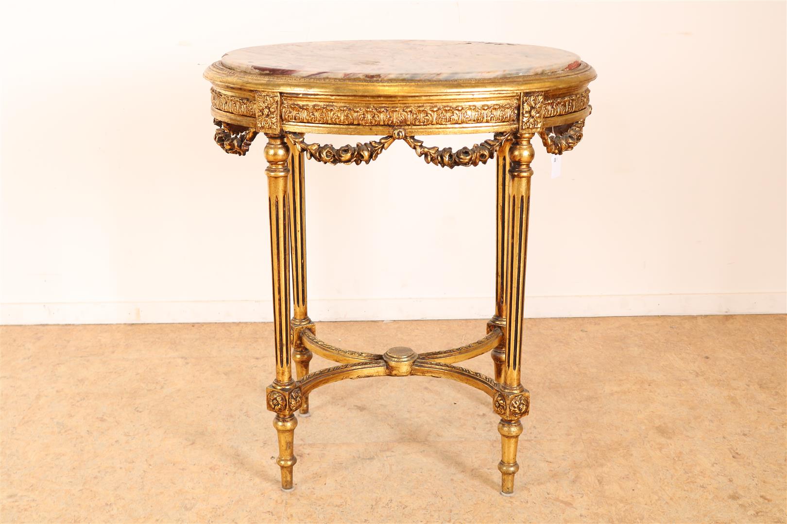 Gilded Louis XVI style side table with marble top on fluted legs connected by rules, 82 x73 x 53