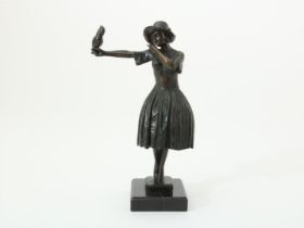 Bronze sculpture of lady with parrot on marble base