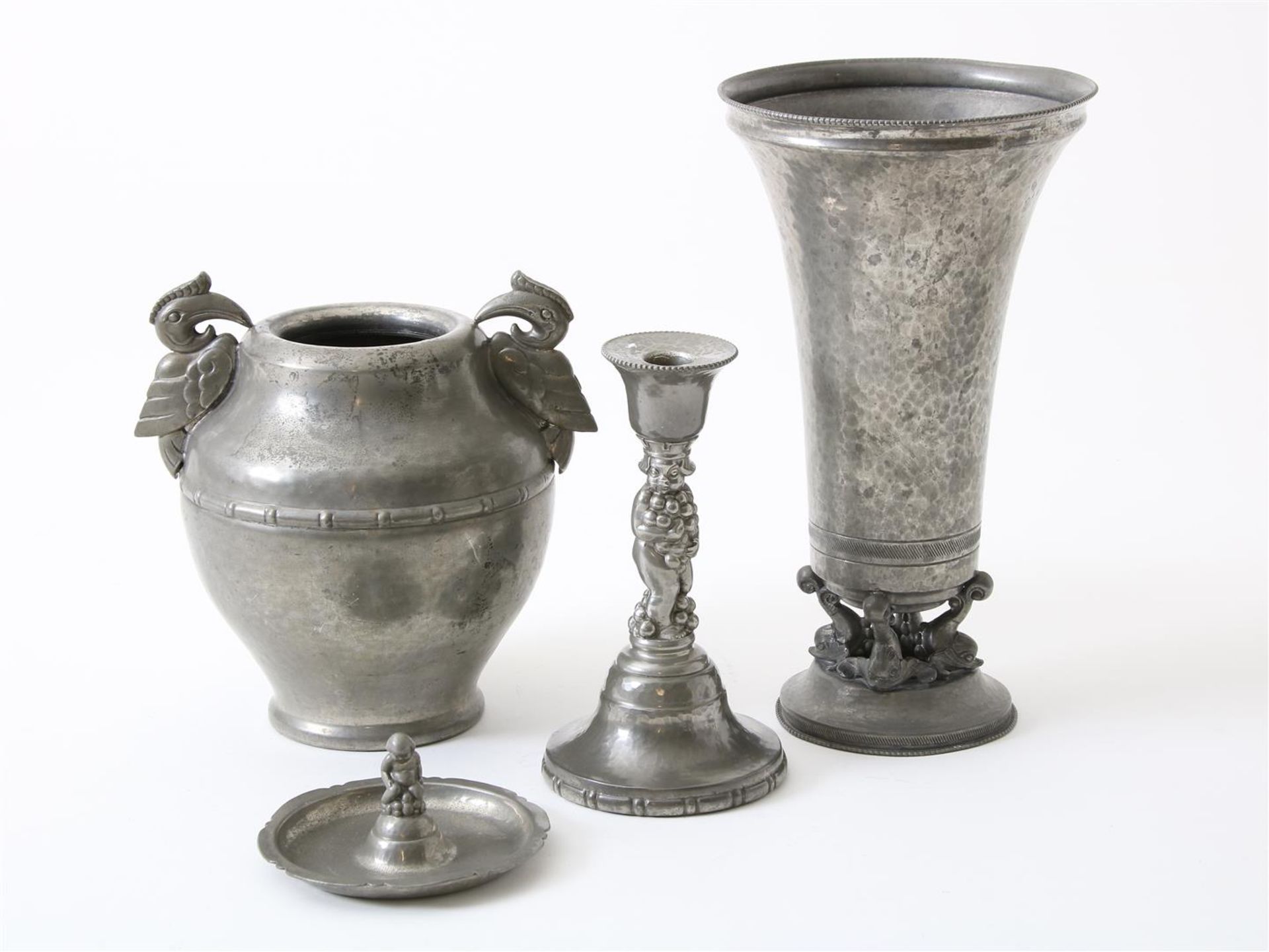 Lot of an Art Deco pewter vase on an openwork base, ashtray, candlestick and vase with Cockatoos,