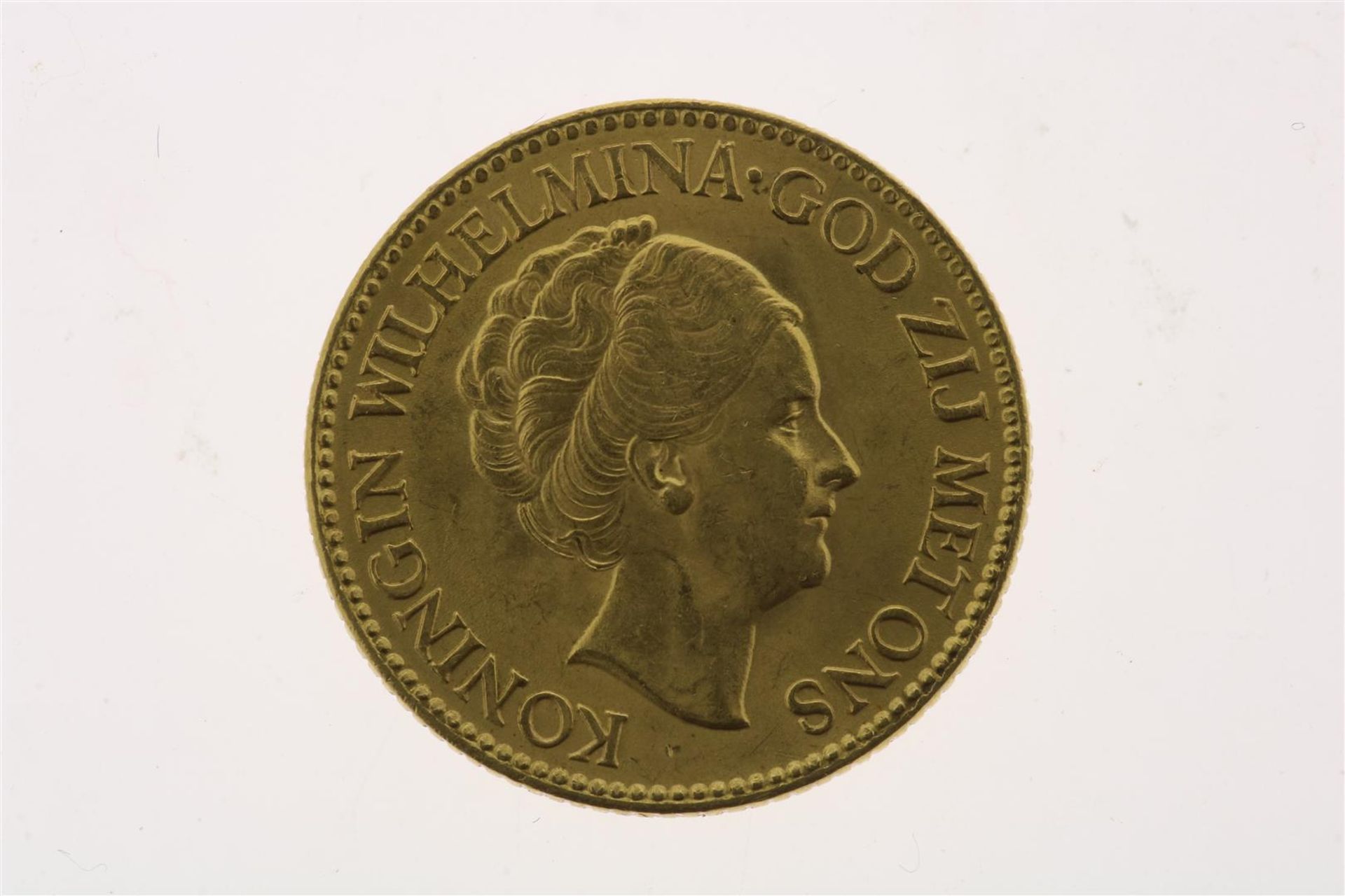 Gold tenner with image of Wilhelmina with updo hair, in an ermine cloak, looking to the right, 1932,