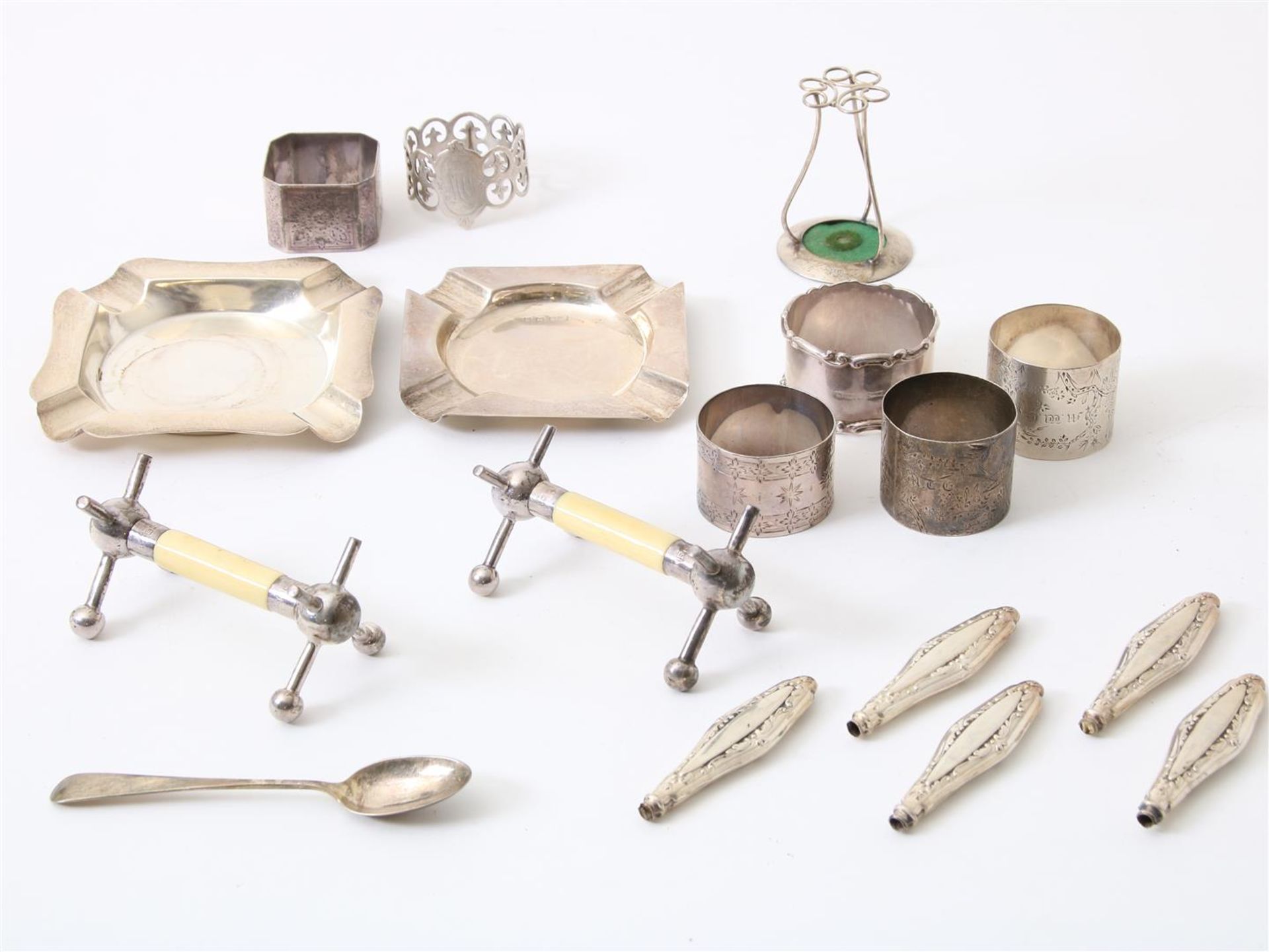 Lot of silverware including ashtray, knife rest, loose tooled handles, holder, various quality,