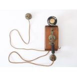 Old telephone with wooden case, La Telphone Integrale Paris, ca. 1930/1940, length: 30 cm.