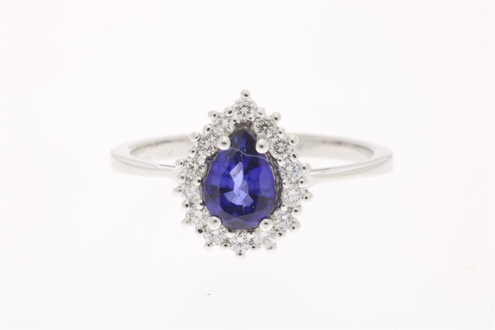 White gold entourage ring, centrally set with sapphire, approximately 0.70 ct. in an entourage of