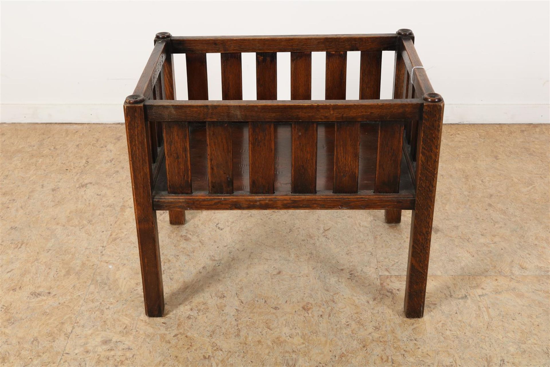 Oak magazine rack, marked with metal plate: “J.R. HOOGEZAND / MEUBILERING / OLD KERKHOF 25 /