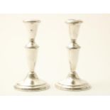 Set of silver one-light candlesticks, height 17 cm, sterling weighted, USA Fith Avenue.